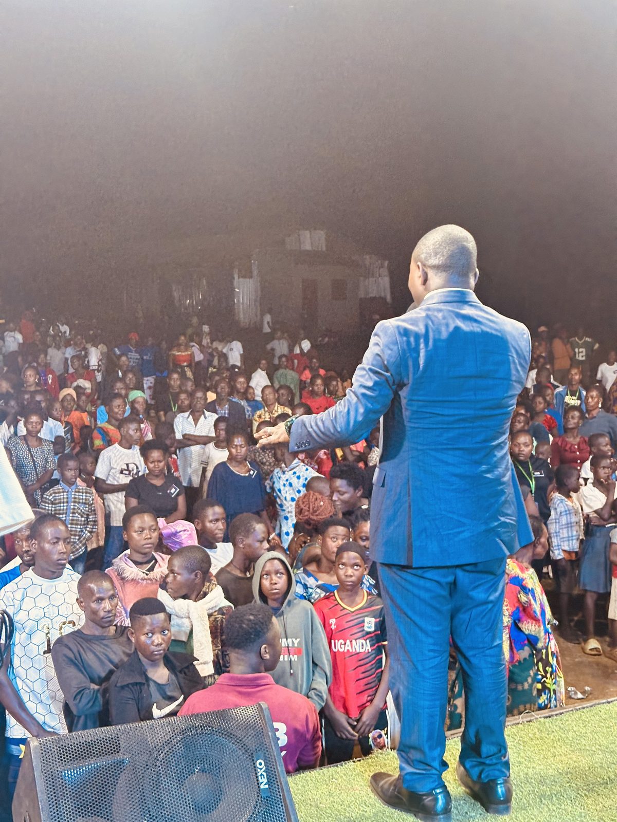 The Kiboga Conference and Crusade opens — worship under the tent as evening falls.